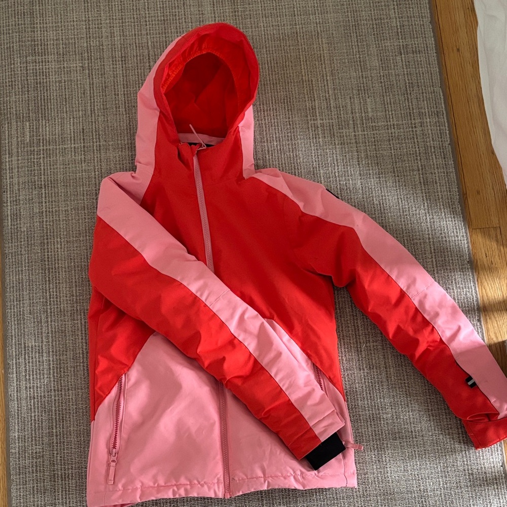 Orangey red and pink ski coat